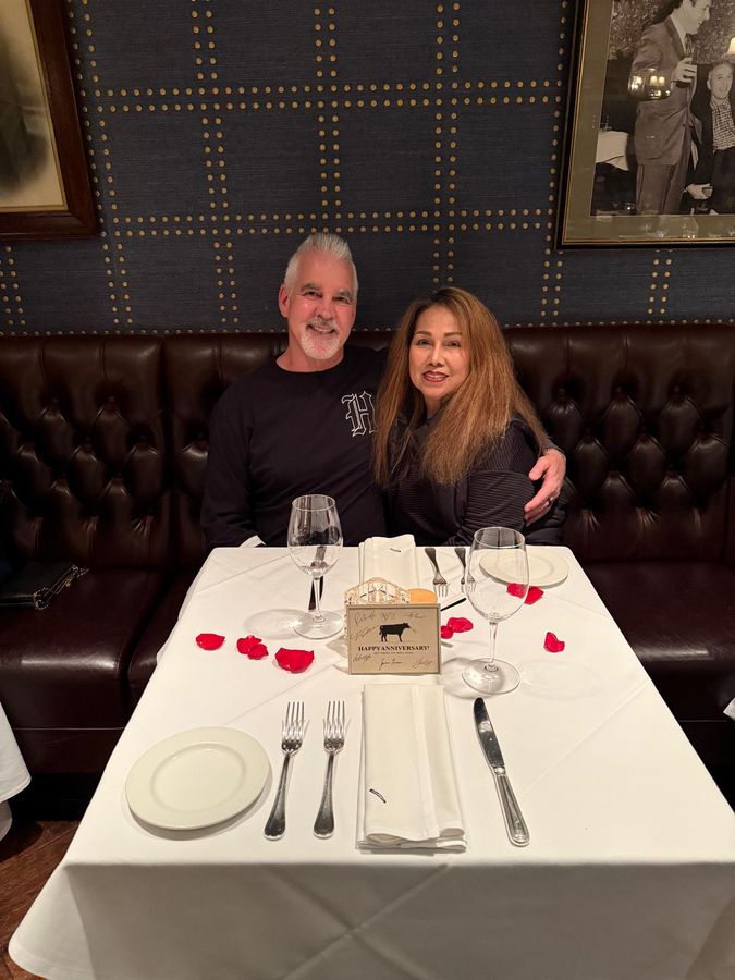 The original photo of a couple at dinner